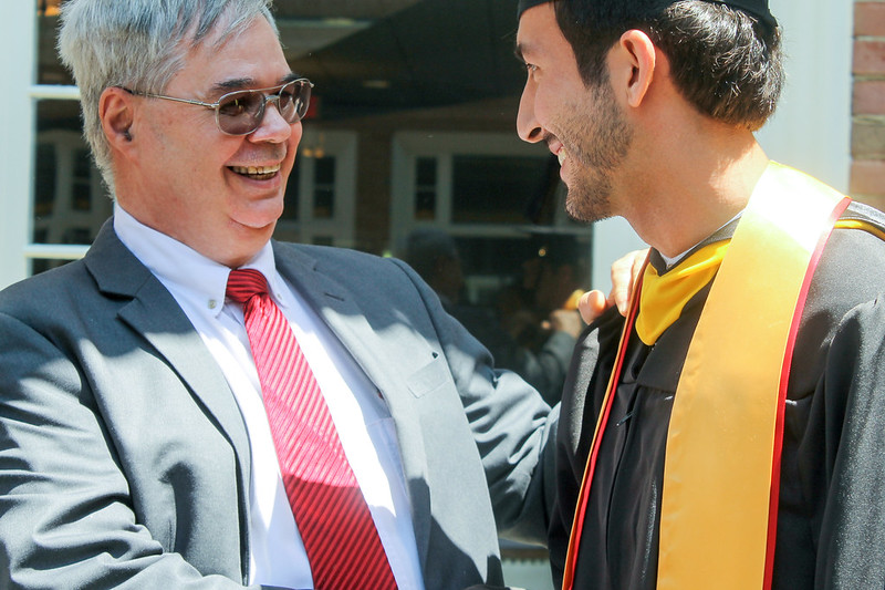 Roy with Student at Graduation