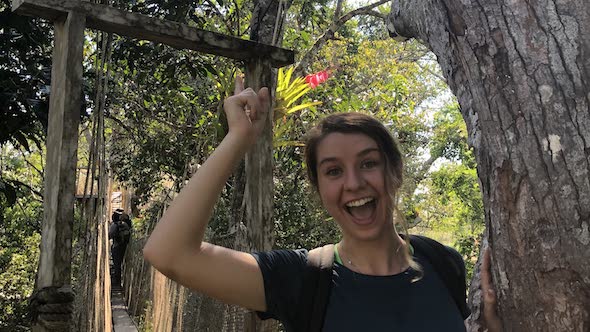 student standing in jungle